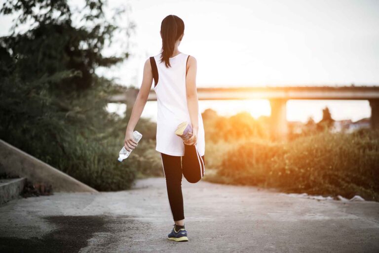 Girl walking outdoors, highlighting the benefits of walking a mile a day and walking 2 miles a day for improved health and fitness.